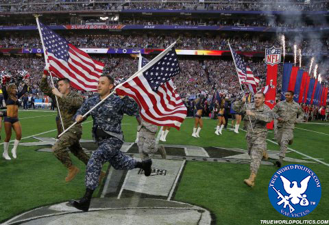 Members of the U.S. military lead the New England Patriots onto the field ahead of the start of the NFL Super Bowl XLIX football game against the Seattle Seahawks in Glendale, Arizona February 1, 2015 - Reuters